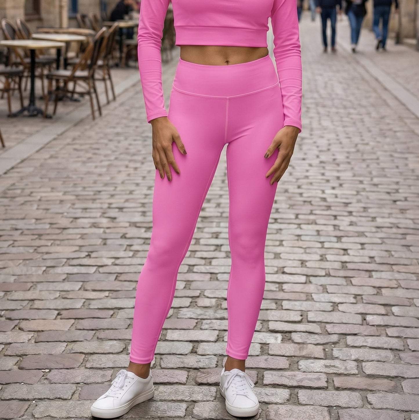 AMMOR PARIS bright pink recycled yoga leggings with a high‑waisted sculpting fit, shown on a model standing against a clean white background, highlighting the smooth microfiber fabric, four‑way stretch, raised waistband and minimal sustainable activewear design.