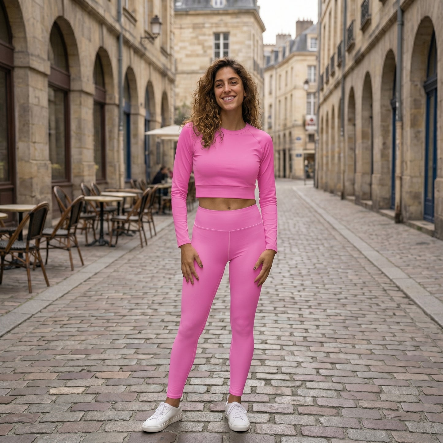AMMOR PARIS bright pink recycled yoga leggings with a high‑waisted sculpting fit, shown on a model standing on a clean white background, emphasizing the smooth microfiber yarn, four‑way stretch performance fabric, raised waistband and sustainable minimal athleisure design ideal for yoga, training and everyday movement.