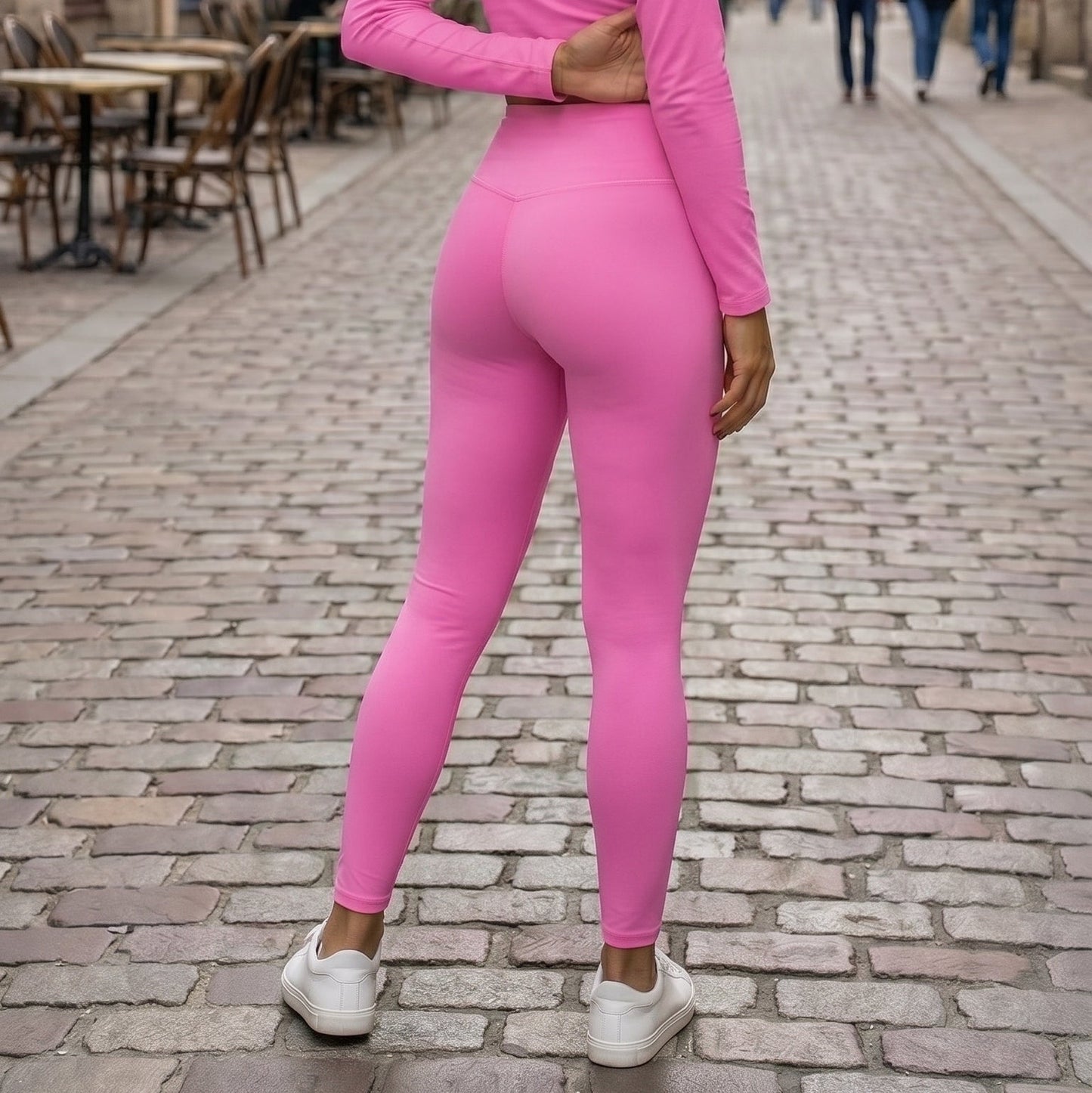 AMMOR PARIS bright pink recycled yoga leggings with a high‑waisted sculpting fit, worn by a model standing on a clean white background, highlighting the smooth microfiber yarn, four‑way stretch recycled performance fabric, raised supportive waistband and minimal sustainable athleisure silhouette; designed for yoga practice, pilates sessions, stretching routines, gym workouts, active daily wear and eco‑conscious modern fashion, emphasizing comfort, flexibility and a sleek body‑contouring fit.

