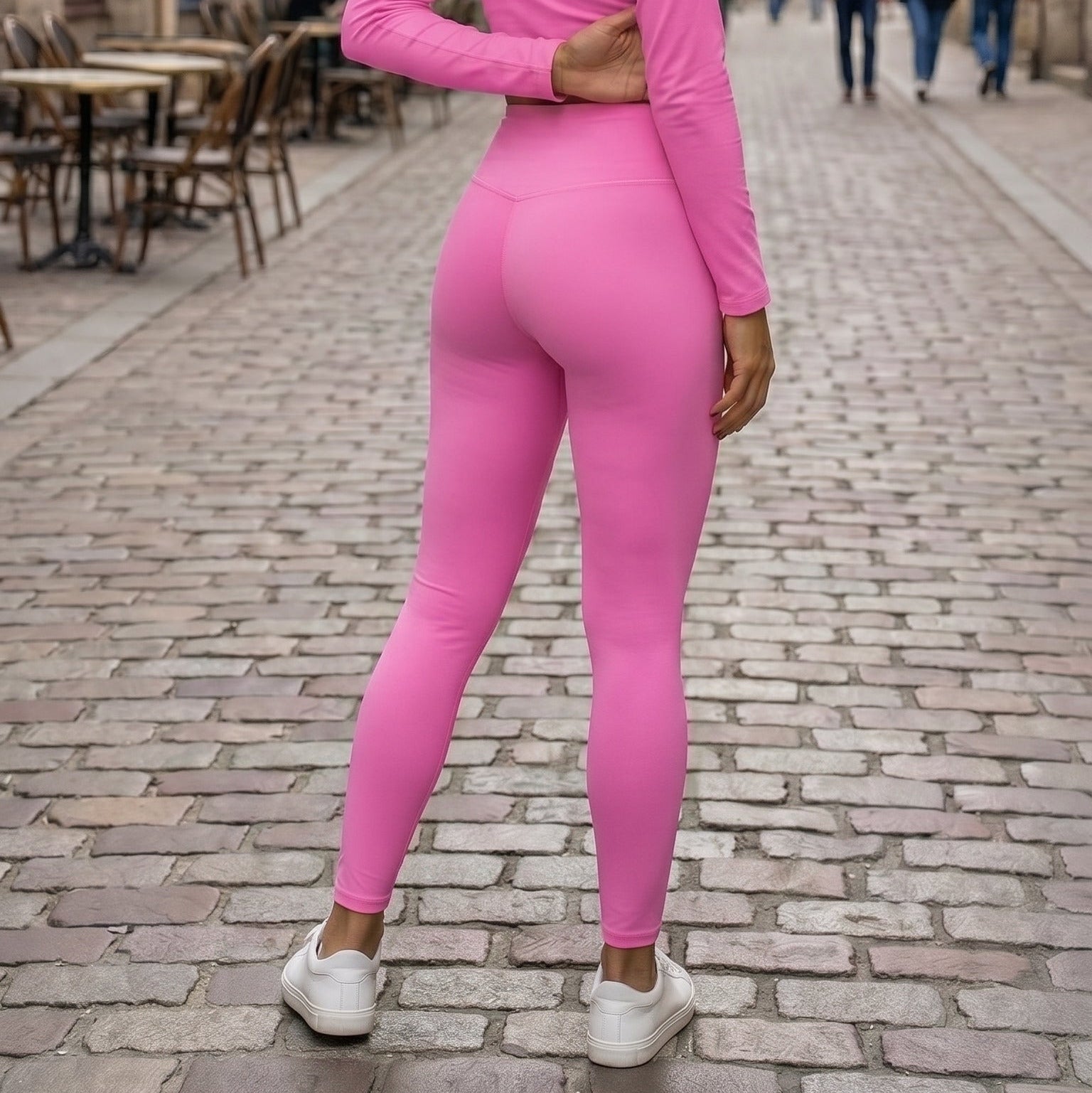 AMMOR PARIS bright pink recycled yoga leggings with a high‑waisted sculpting fit, worn by a model standing on a clean white background, highlighting the smooth microfiber yarn, four‑way stretch recycled performance fabric, raised supportive waistband and minimal sustainable athleisure silhouette; designed for yoga practice, pilates sessions, stretching routines, gym workouts, active daily wear and eco‑conscious modern fashion, emphasizing comfort, flexibility and a sleek body‑contouring fit.

