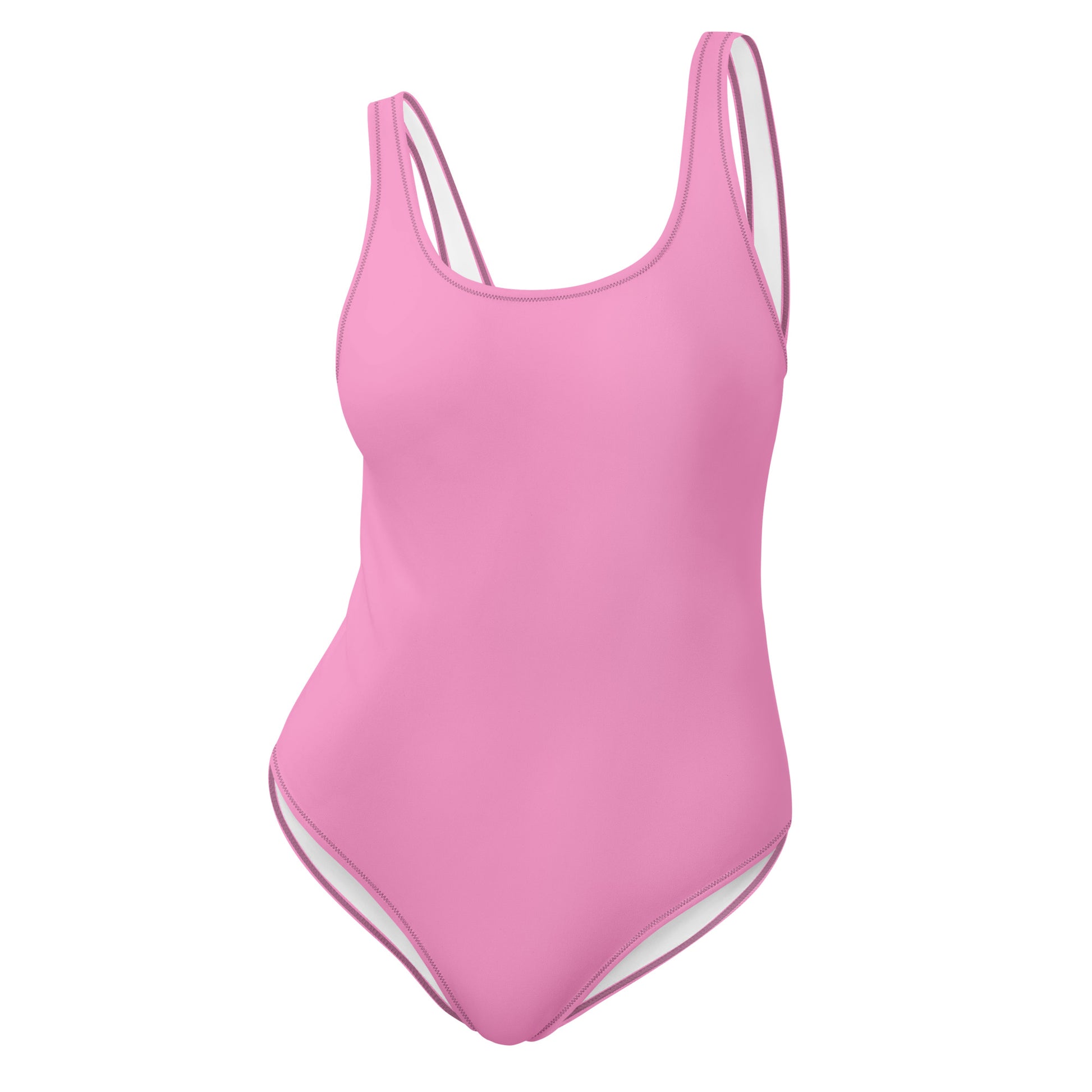 AMMOR PARIS pink one‑piece swimsuit with wide supportive straps and a clean scoop neckline, photographed on a deep black background to highlight its sculpting minimal silhouette, recycled luxury fabric and the brand’s signature Paris‑born sustainable swimwear craftsmanship.