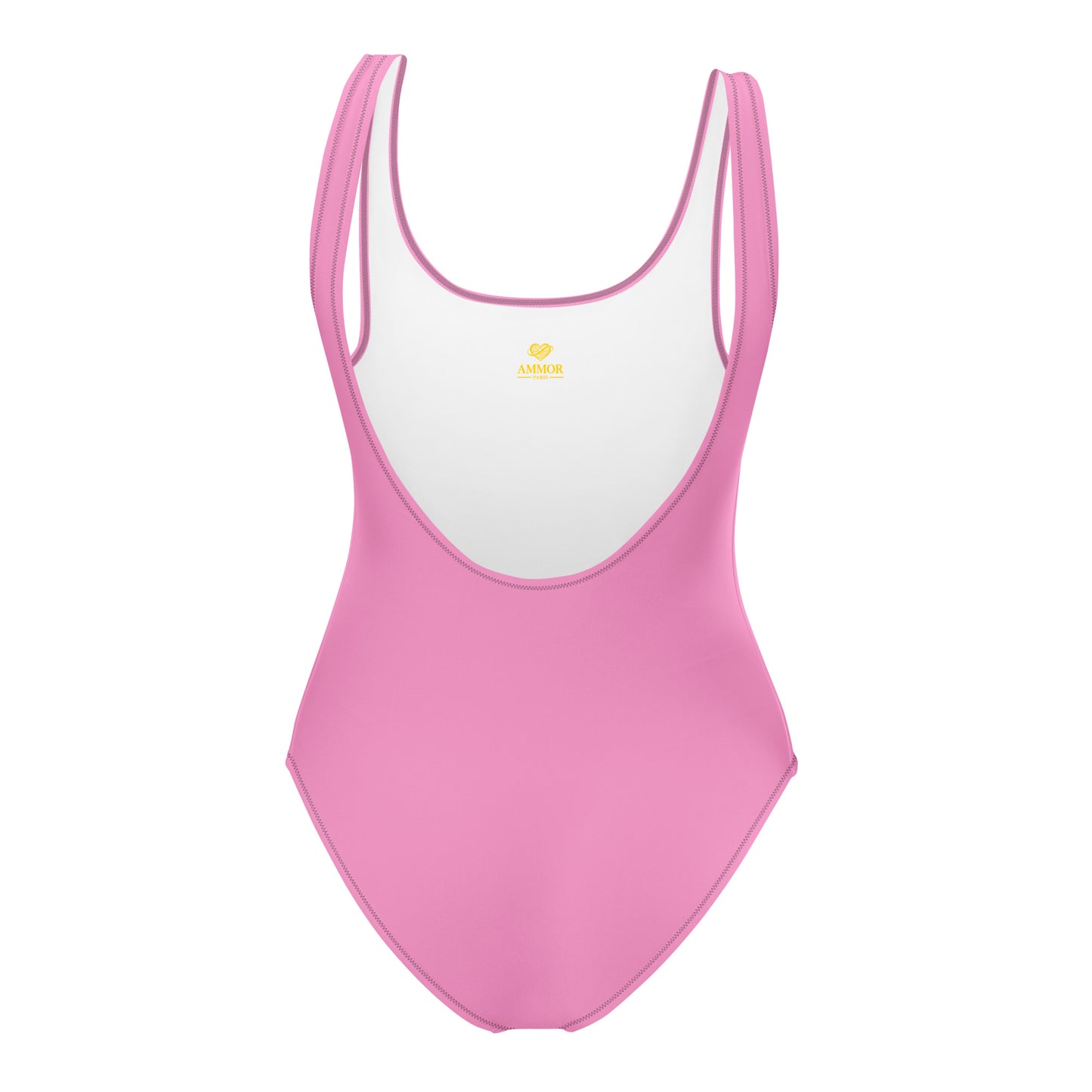 AMMOR PARIS pink one‑piece swimsuit with wide supportive straps and a clean scoop neckline, photographed on a deep black background to showcase its sculpting minimal silhouette, recycled luxury fabric and the brand’s elevated Paris‑born sustainable swimwear identity.