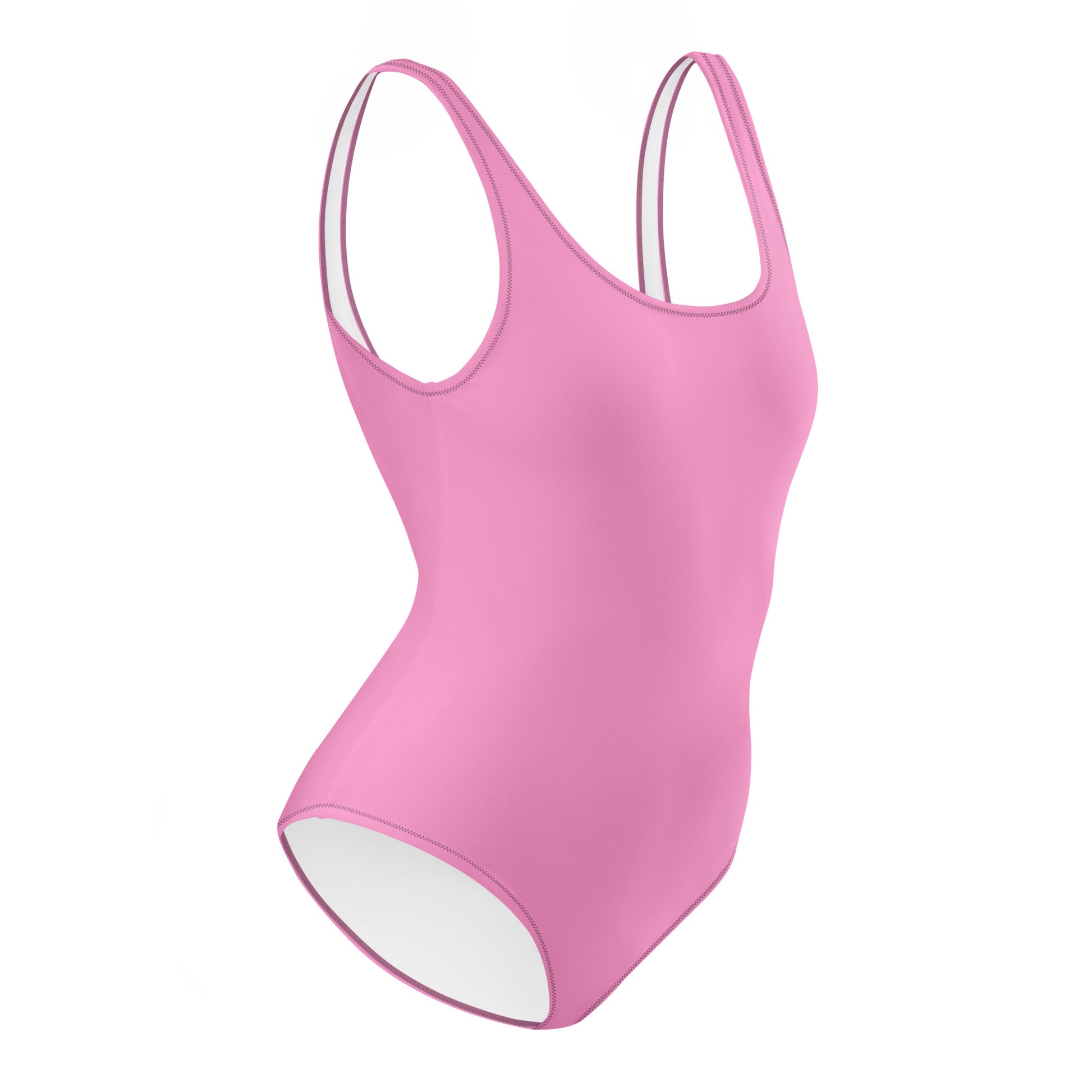 AMMOR PARIS pink one‑piece swimsuit with wide supportive straps and a clean scoop neckline, photographed on a deep black background to showcase its sculpting minimal silhouette, recycled luxury fabric and the brand’s refined Paris‑born sustainable swimwear design language.