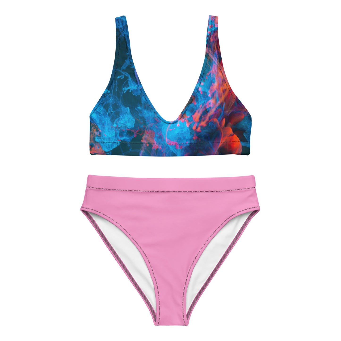 Female model wearing a red‑blue patterned bikini top with high‑waisted pink bottoms, AMMOR PARIS recycled bikini set photographed in a clean studio for luxury sustainable swimwear, modern designer summer fashion and elevated beachwear styling.
