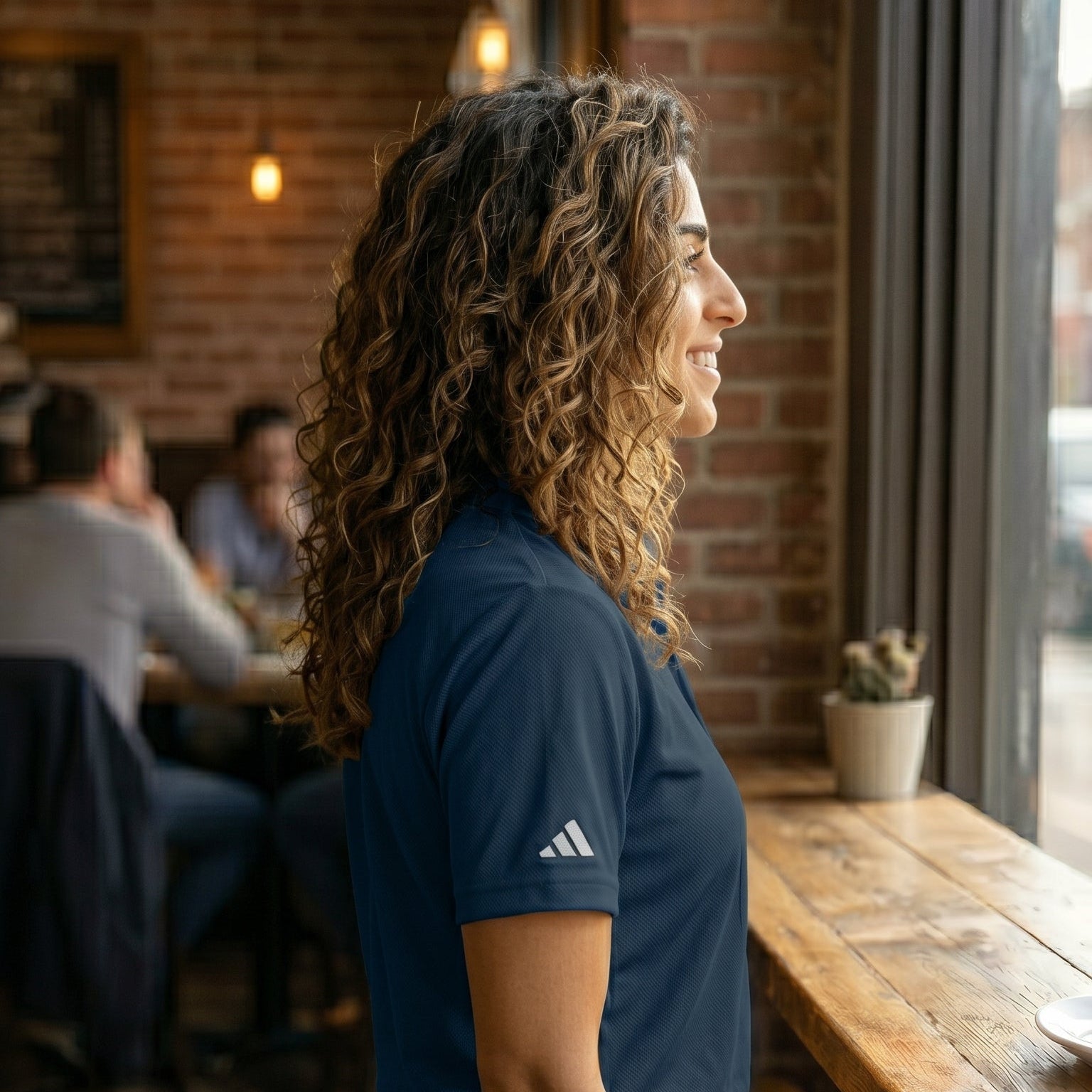 High‑resolution image of a navy adidas polo customized with AMMOR PARIS embroidery, capturing the clean lines, athletic fit, and elevated street‑lux aesthetic of the piece.